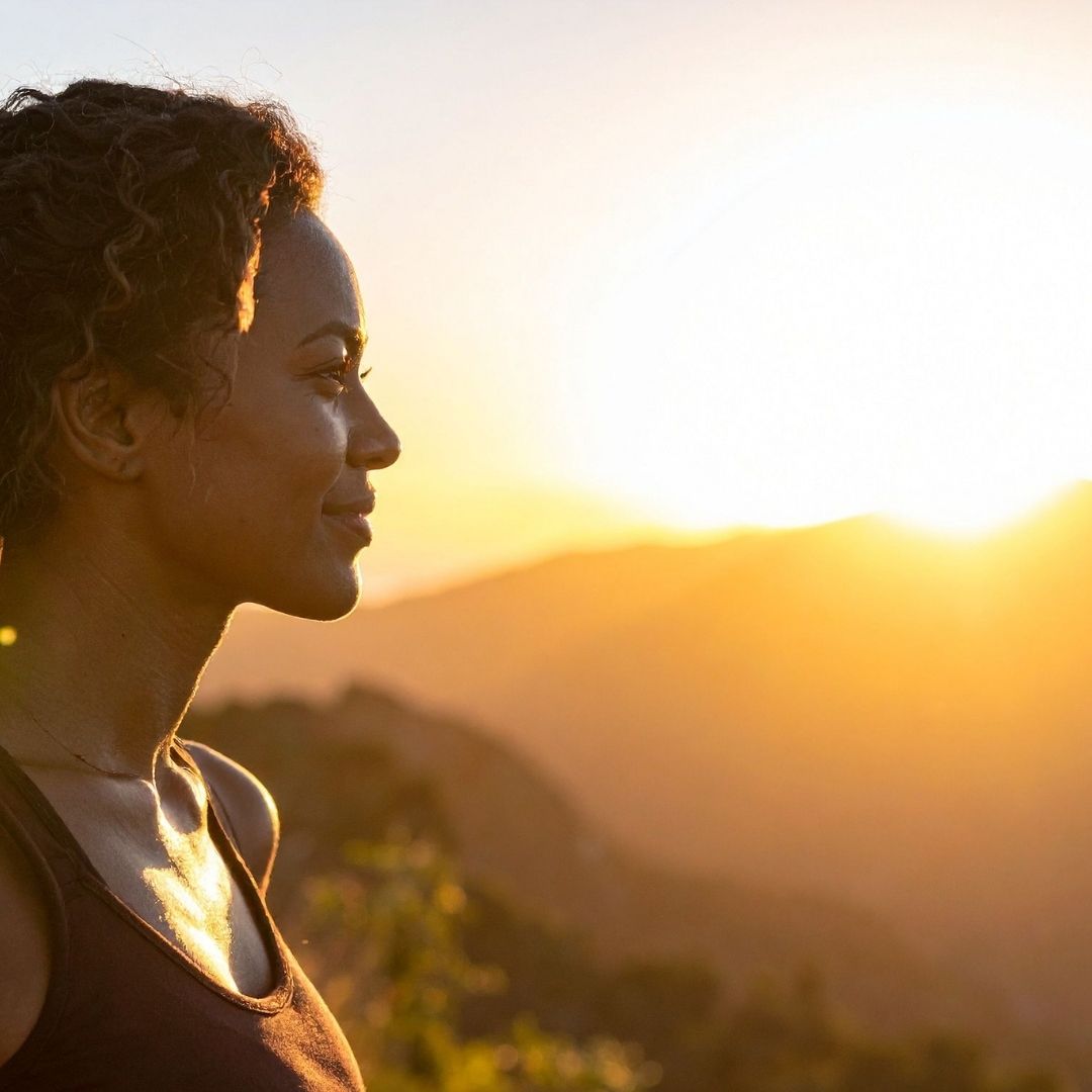 Woman enjoying morning daylight as part of an evidence-based sleep routine for PMOS.